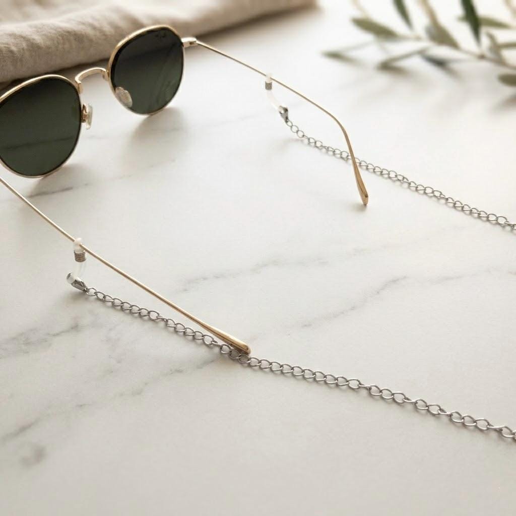 Stainless steel eyeglasses chain in gold tone with adjustable rubber grips for secure glasses retention