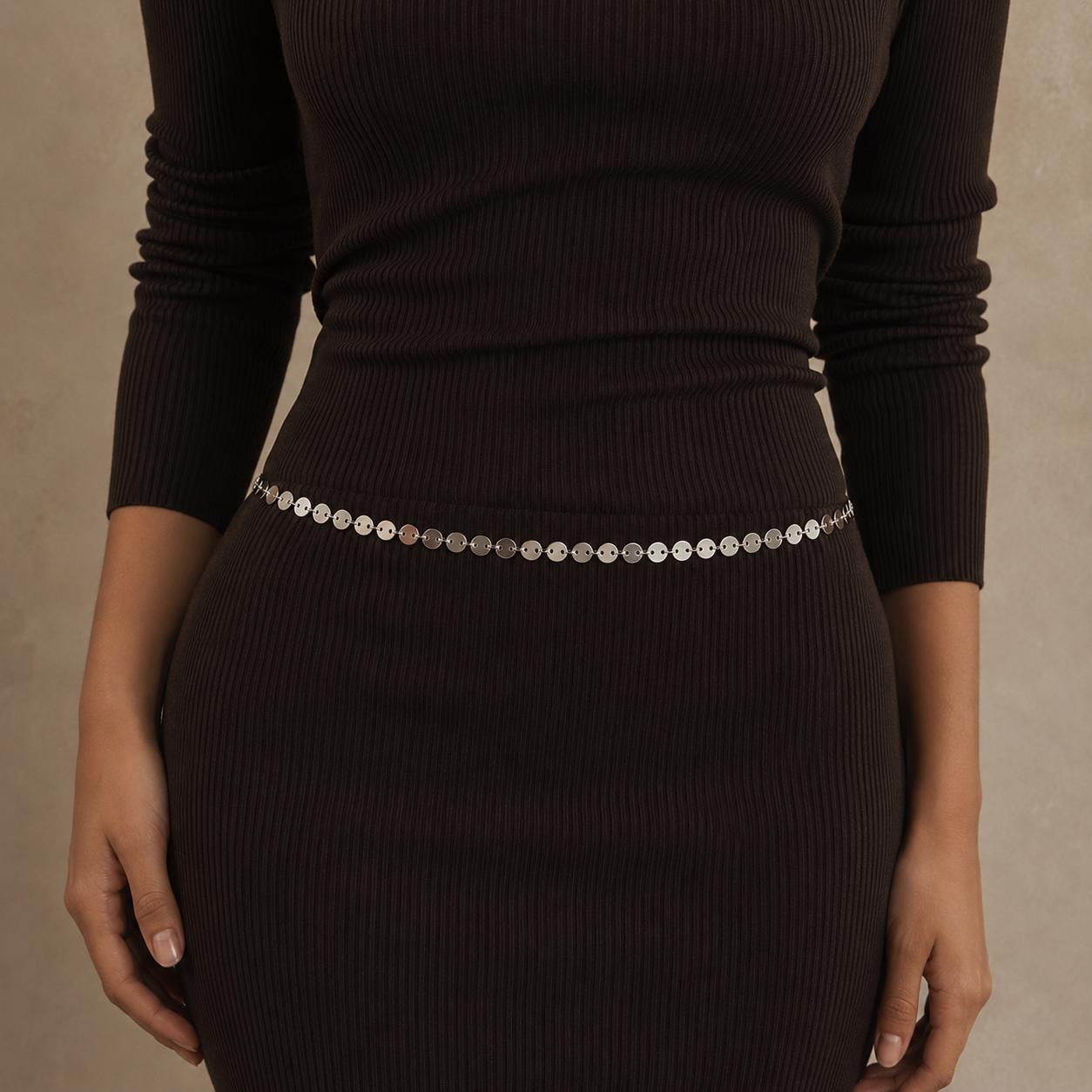 Silver-tone stainless steel chain waist belt draped over dress for minimalist body jewelry styling
