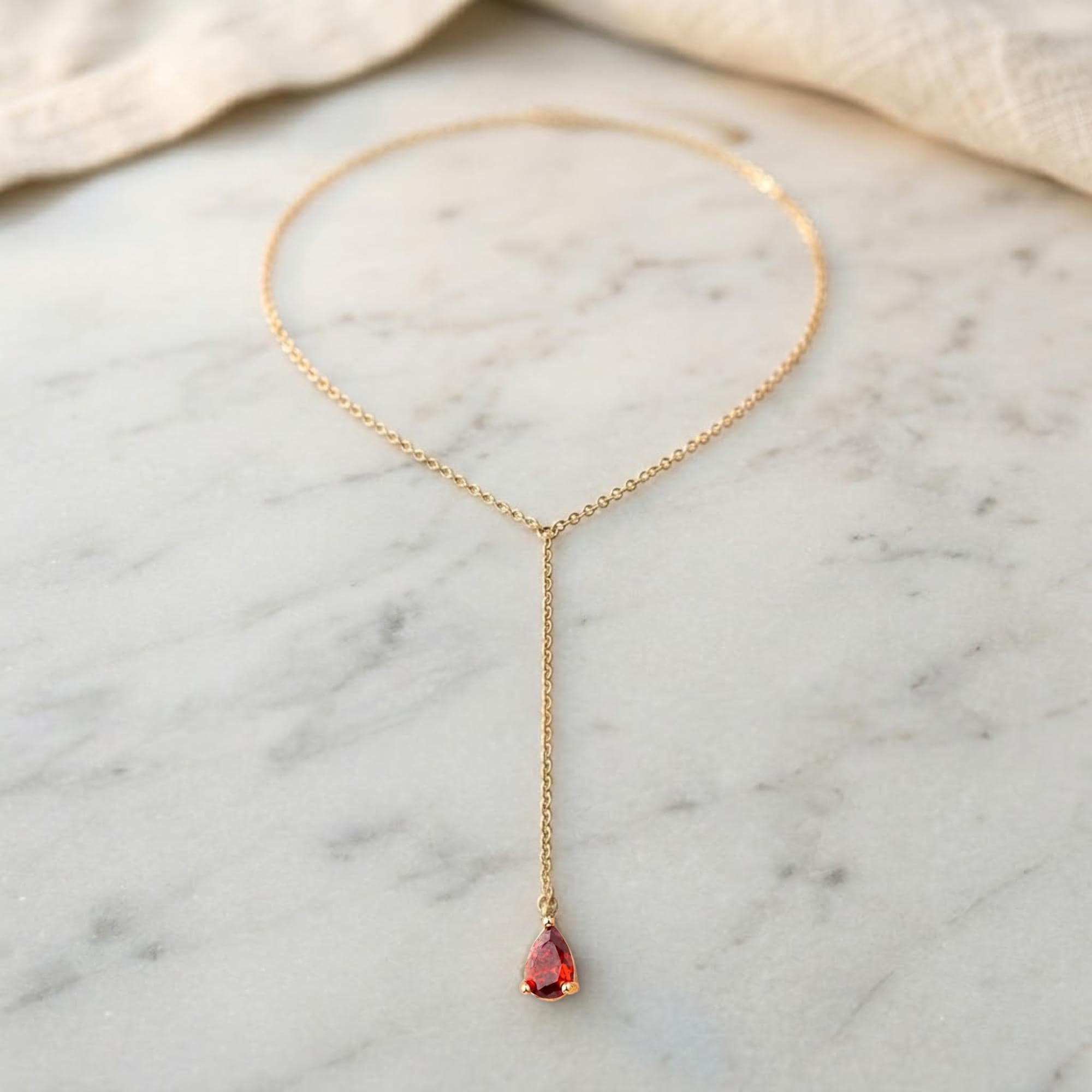 Gold-tone stainless steel back chain necklace with personalized birthstone charm for bridal wear