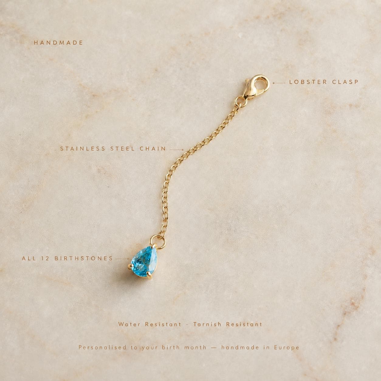 Gold-tone stainless steel birthstone bikini clip chain with gemstone charm for personalized beach jewelry
