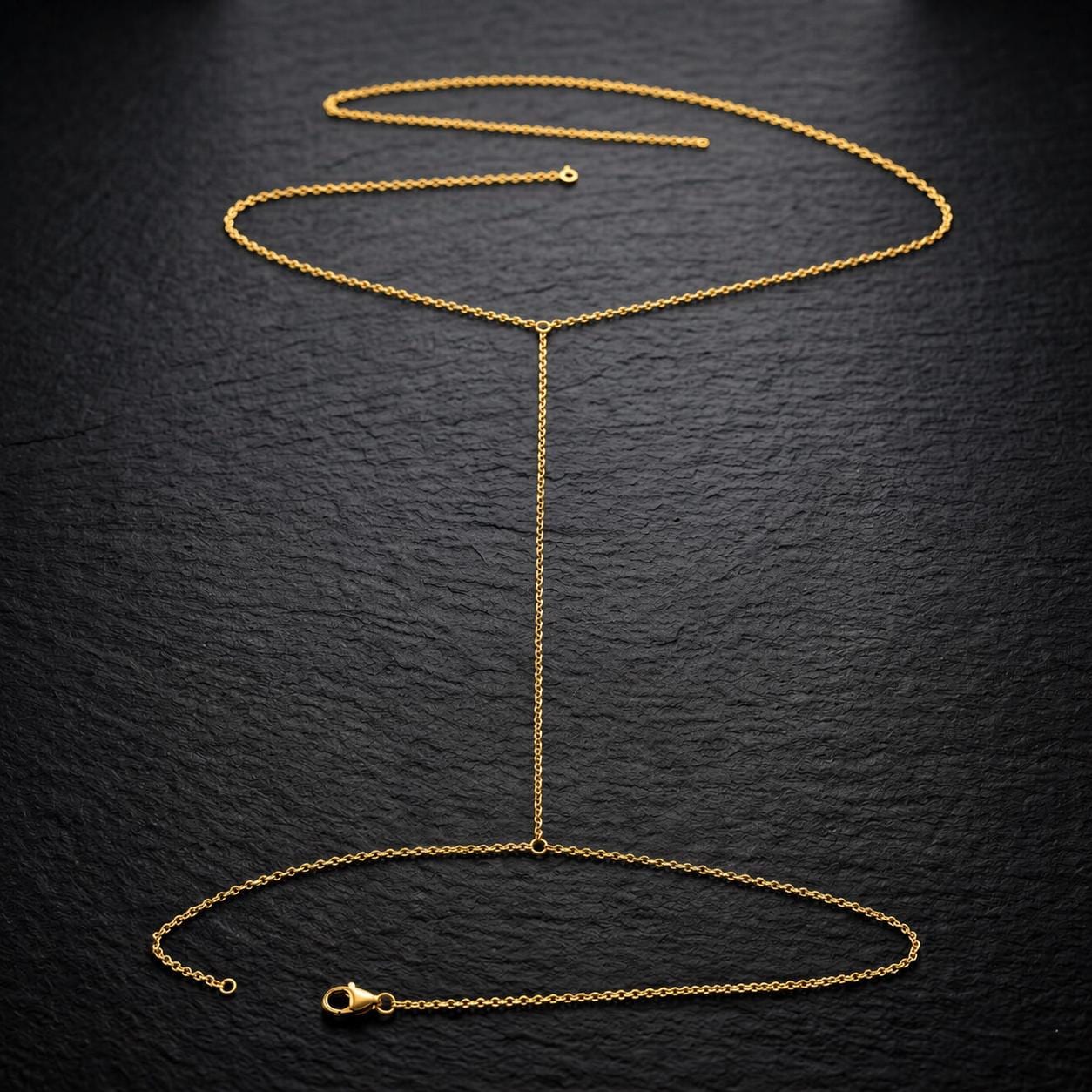 Delicate gold tone stainless steel thigh chain body jewelry for festival wear and editorial styling