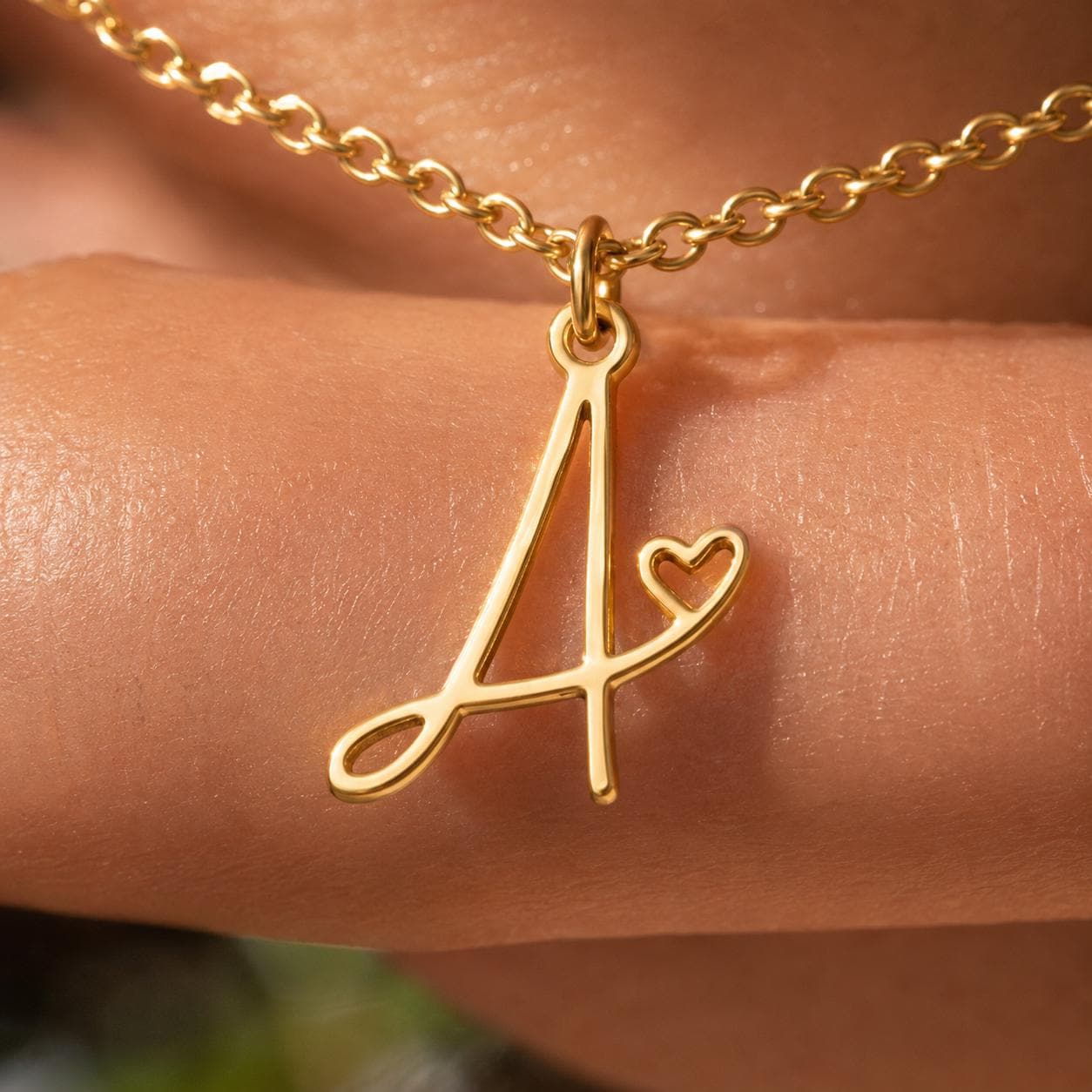 Delicate gold monogram letter necklace in stainless steel, personalised initial charm for everyday wear