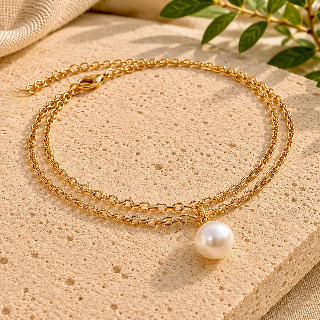 Delicate gold stainless steel pearl charm bracelet with dual strands for everyday wear