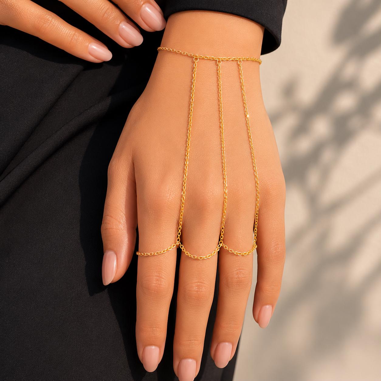 Delicate gold stainless steel hand chain draping wrist to fingers, bohemian slave bracelet style hand jewelry