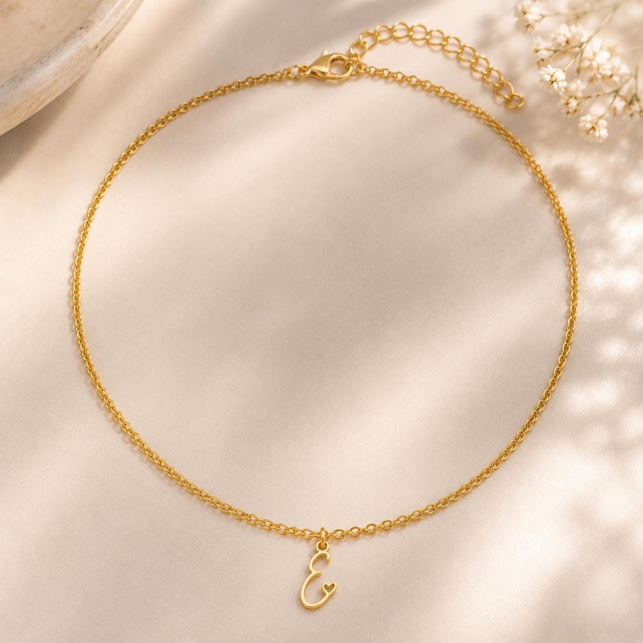 Delicate gold monogram letter necklace in stainless steel, personalised initial charm for everyday wear