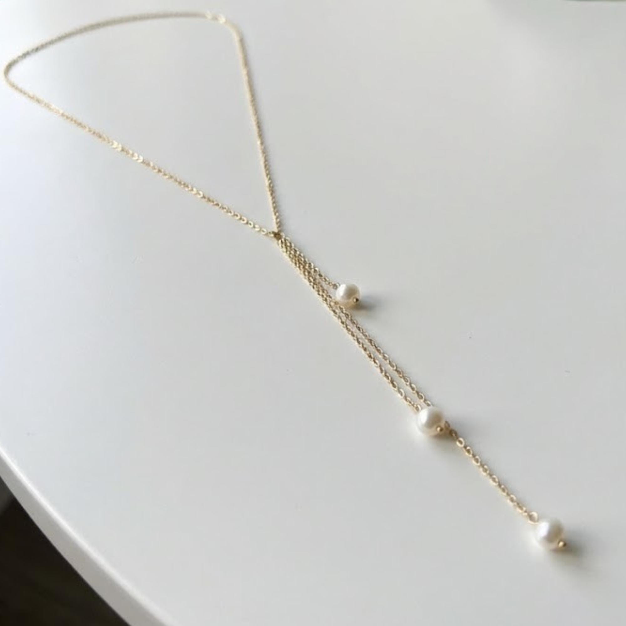 Gold tone stainless steel pearl lariat back body chain for open-back gown styling