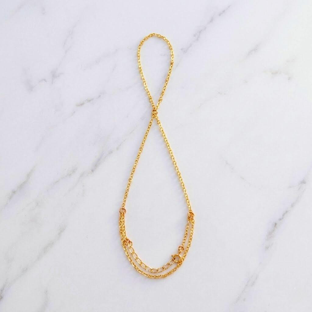Delicate boho finger hand chain in gold stainless steel, handcrafted festival hand jewelry connecting ring to bracelet