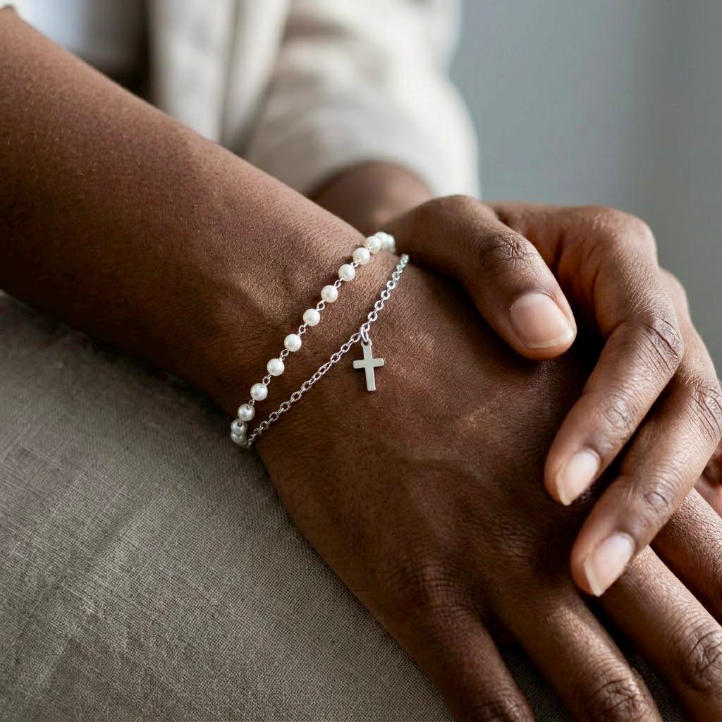 Delicate gold stainless steel pearl bracelet with cross charm for meaningful occasions