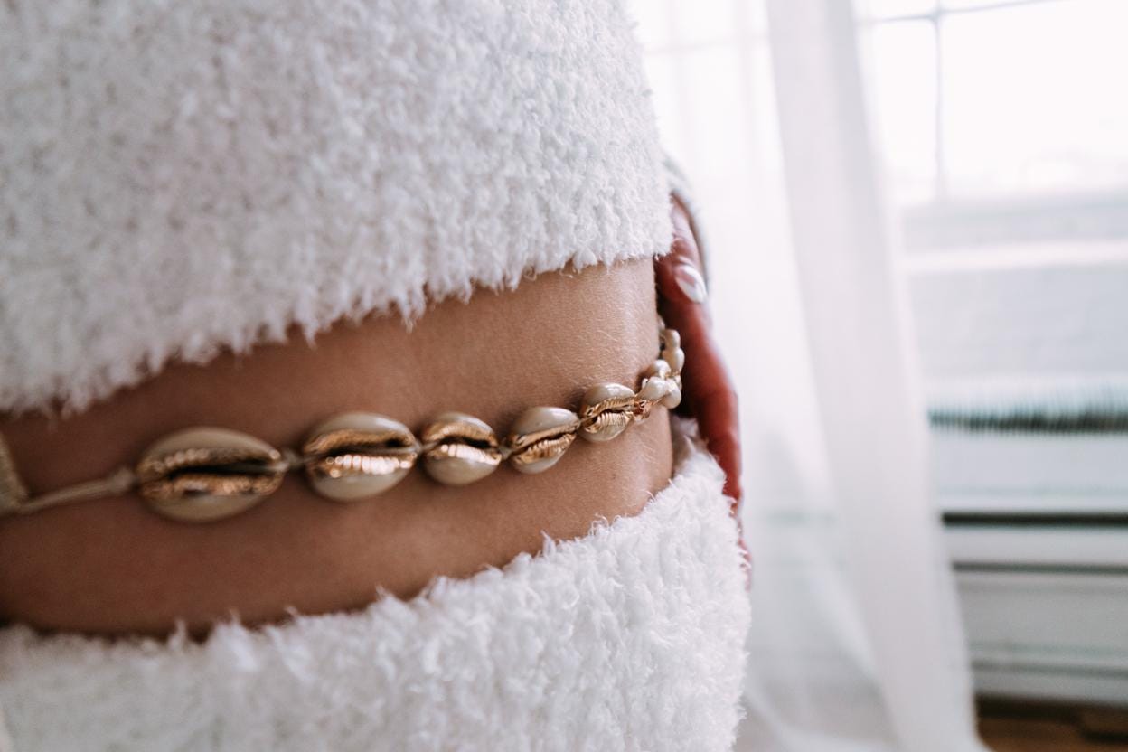 Handcrafted cowrie shell belly chain with natural shells on pull string cord, boho waist chain accessory for beach wear
