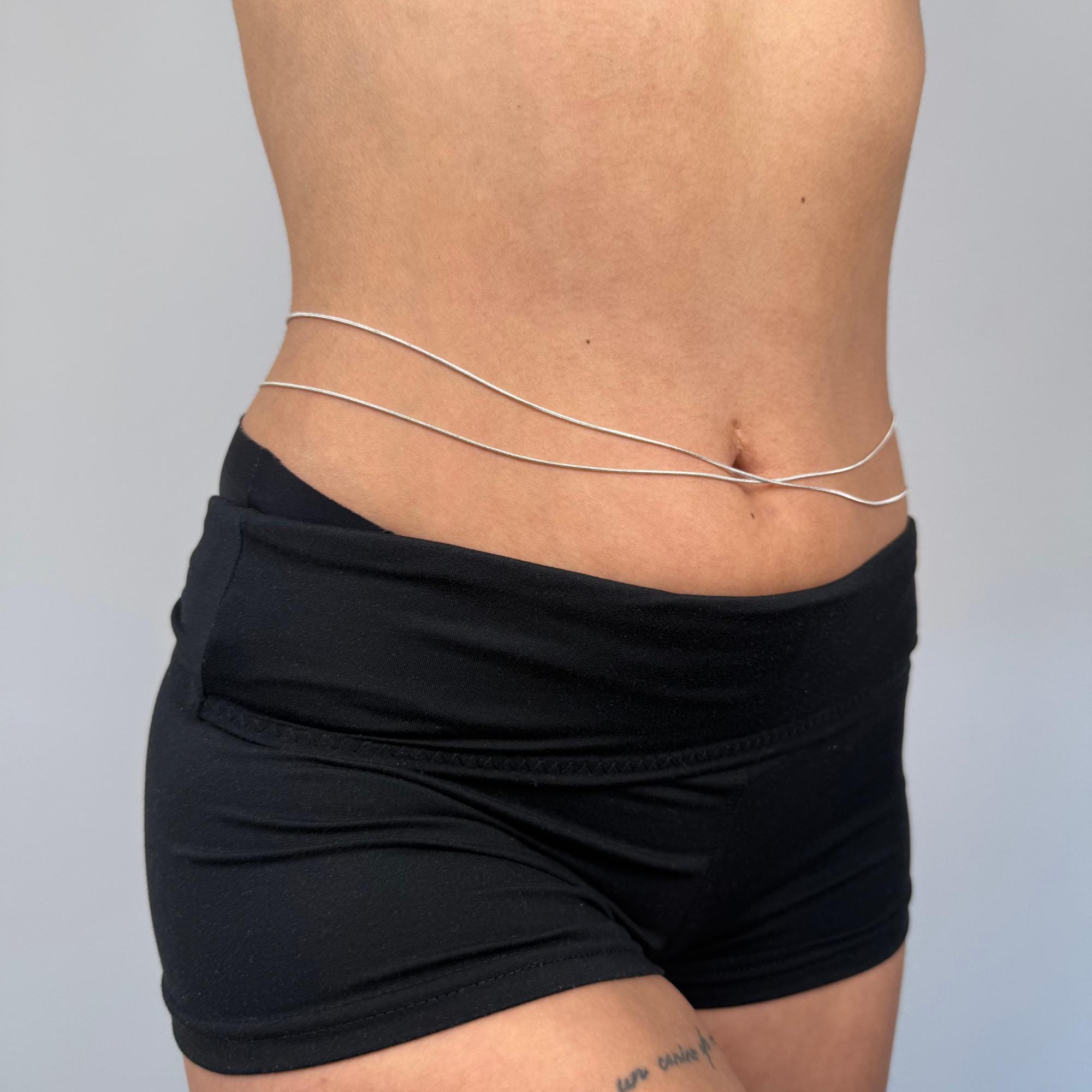 Delicate layered silver belly chain in stainless steel, minimalist waist accessory for beach and everyday wear