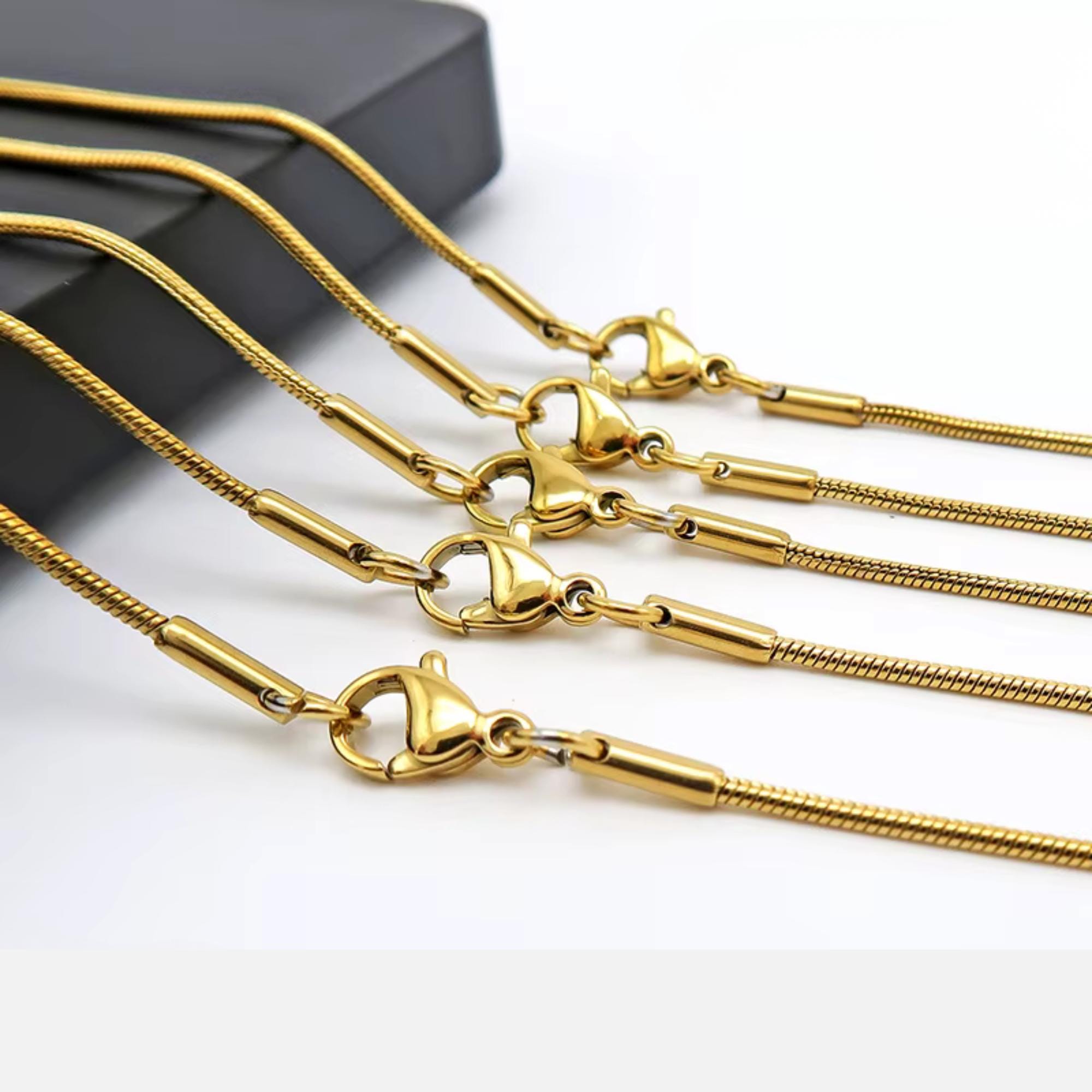 Gold-tone stainless steel cross belly chain for layering waist jewelry and everyday wear
