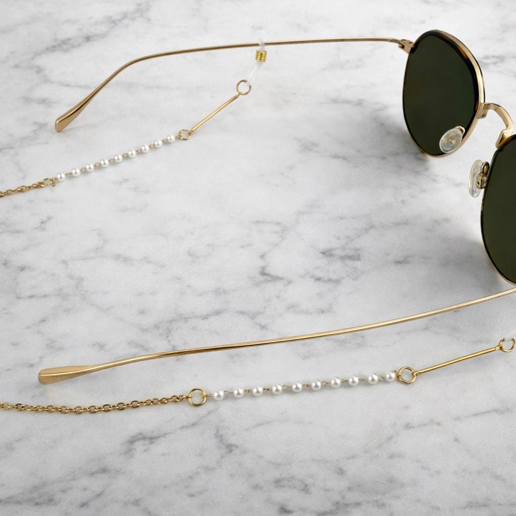 Delicate gold-tone stainless steel pearl glasses chain with elegant pearl accents for eyewear