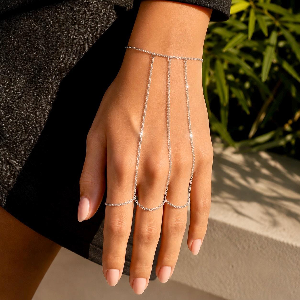 Delicate gold stainless steel hand chain draping wrist to fingers, bohemian slave bracelet style hand jewelry