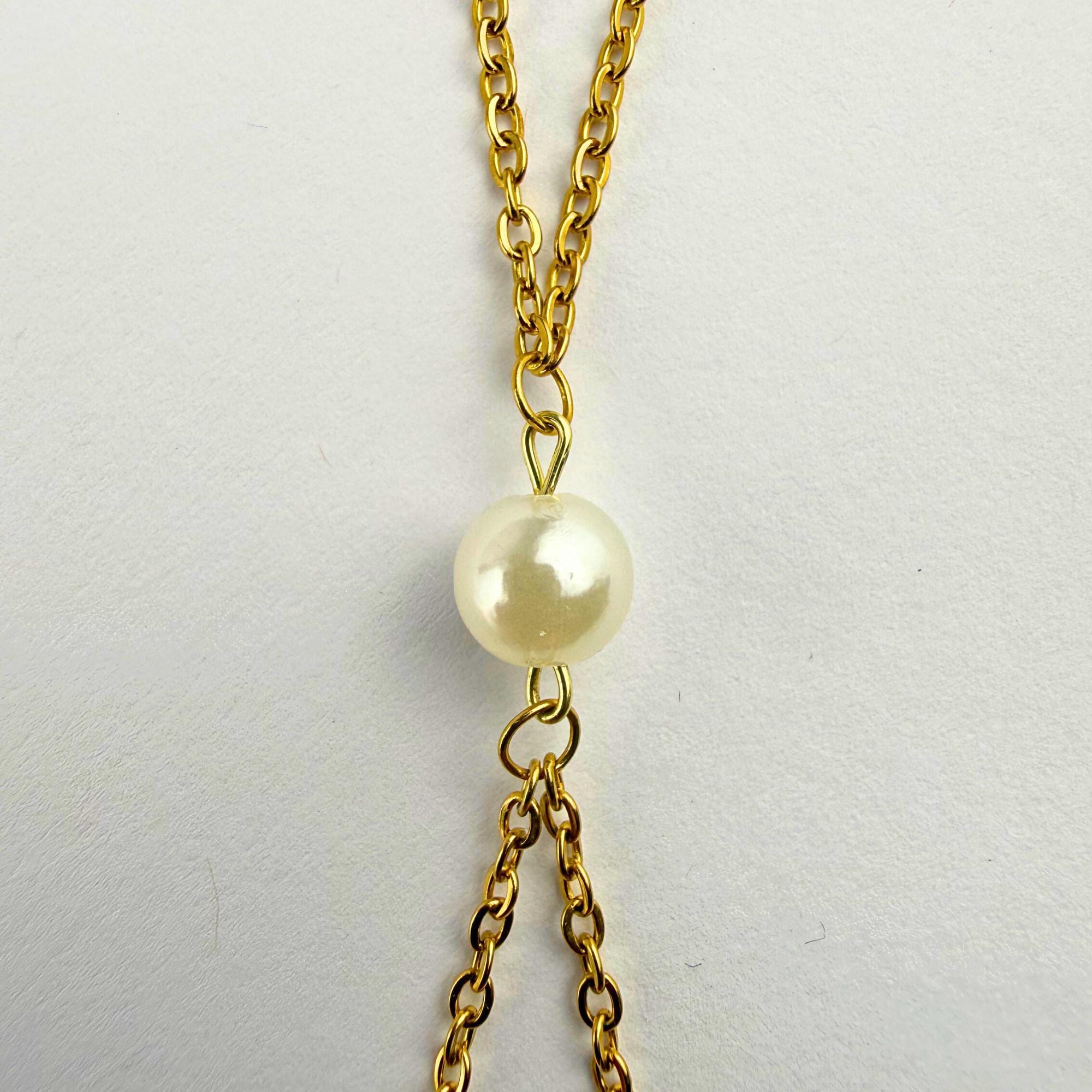 Gold tone stainless steel pearl body chain with delicate bralette design for beach and festival wear