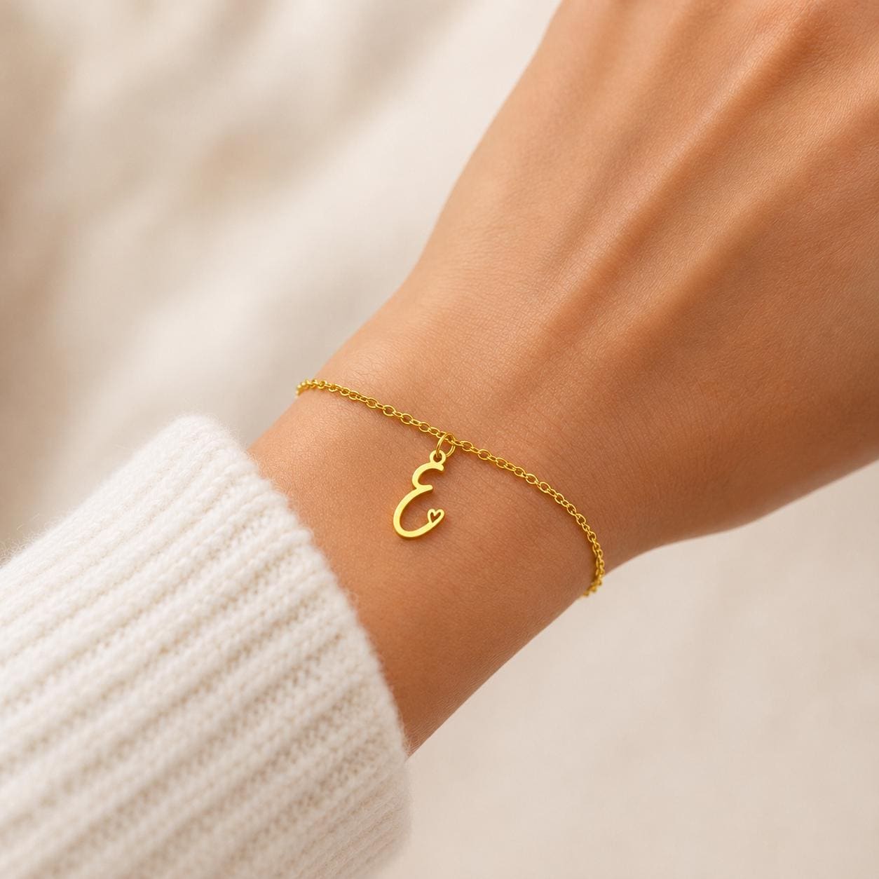 Gold stainless steel personalized initial bracelet with dainty cursive charm, handcrafted minimalist design