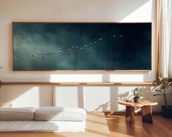 Migrating birds gliding across a moody blue sky creating a poetic scene of freedom and quiet movement, premium panoramic large wall art