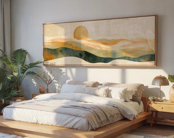 May include: A bedroom scene featuring a low wooden bed frame with beige bedding and pillows. Above the bed hangs a large rectangular artwork with a landscape design in shades of yellow, green, and beige. A potted plant and a side table with a lamp are also visible.