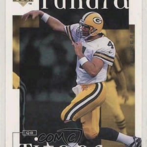 May include: A Green Bay Packers football card featuring a player in a yellow and green uniform throwing a football. The card has the words "Tundra" and "Titans" on it. The Upper Deck logo is visible.