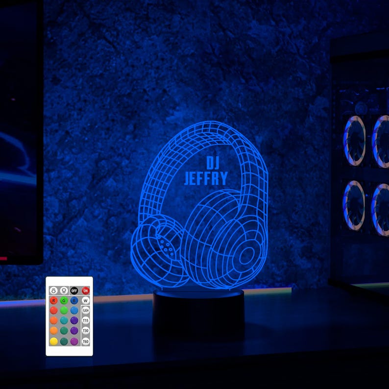 May include: A blue 3D printed LED night light shaped like headphones with the text "DJ JEFFRY" on the side. The light is on a black base and comes with a remote control.