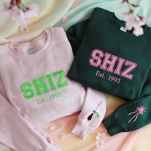 Shiz Sweatshirt Hoodie Embroidered Wickeds Movie, Wizard Shiz University Shirt, Defying Gravitiy Shirt, Best Wickeds Merch Movie Lover Gift
