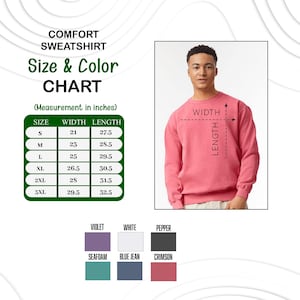 K&ouml;nnte beinhalten: Ein korallenfarbenes Sweatshirt mit einer Gr&ouml;&szlig;en- und Farbtabelle. Die Tabelle zeigt die Ma&szlig;e in Zoll f&uuml;r die Gr&ouml;&szlig;en S bis 3XL. Farbfelder umfassen Violett, Wei&szlig;, Pfeffer, Meerschaum, Blue Jean und Karmesinrot.