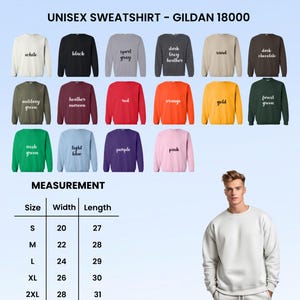 May include: A display of Gildan 18000 unisex sweatshirts in various colors, including white, black, and red. The image also shows a size chart with measurements in inches, and a person wearing a white sweatshirt.