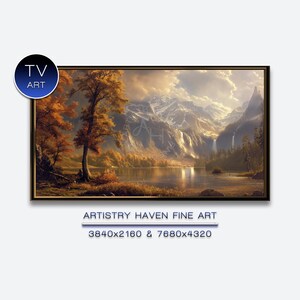 Puede incluir: Una pintura de paisaje enmarcada que presenta un lago sereno, cascadas y montañas majestuosas bajo un cielo nublado. La obra de arte muestra colores otoñales con árboles en tonos naranja y dorado. El texto "TV ART" y "ARTISTRY HAVEN FINE ART" son visibles.