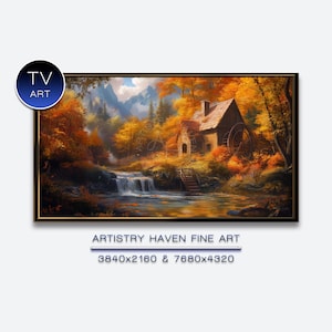 Puede incluir: Una pintura de paisaje enmarcada representa una escena otoñal serena. Un pequeño edificio de piedra con una rueda hidráulica se encuentra junto a una cascada y un río. La obra presenta un follaje naranja y amarillo vibrante, con montañas al fondo. El texto "TV ART" y "ARTISTRY HAVEN FINE ART" son visibles.