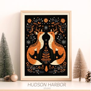 May include: A black and white illustration of two foxes with antlers, facing each other. The foxes are surrounded by a symmetrical pattern of orange, gray, and white flowers and snowflakes. The text "HUDSON HARBOR STUDIO" is at the bottom of the image.