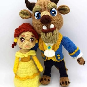 May include: A crocheted plush toy set featuring Belle and the Beast from the Disney movie Beauty and the Beast. Belle is wearing a yellow dress and the Beast is wearing a blue jacket with gold accents.