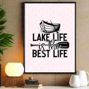 May include: Black framed wall art with the text "LAKE LIFE is the BEST LIFE" in a bold, modern font. The design includes a silhouette of a boat and an oar, perfect for lake house decor or a gift for lake lovers.