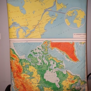 May include: A large, vintage-style wall map featuring two distinct sections. The top panel displays the St. Lawrence Seaway with a yellow background, while the bottom panel shows a detailed topographical map of Canada with elevation color coding.