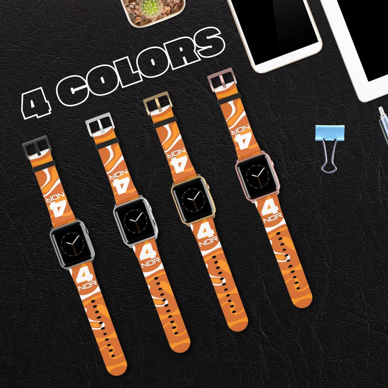 May include: Four smartwatches with orange and white patterned bands, each displaying the number "4" and the letters "NOR". The watch faces are black. The text "4 COLORS" is above the watches.