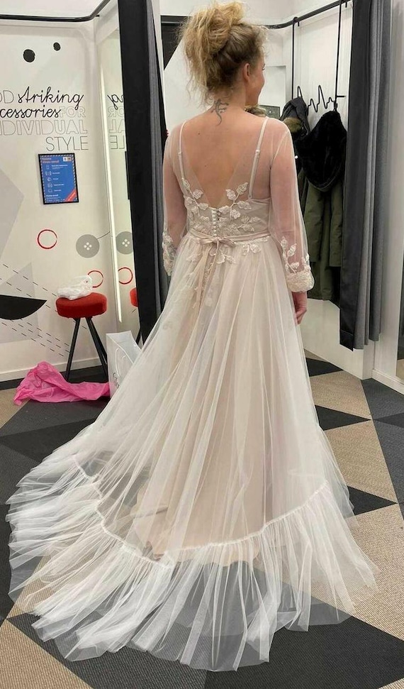how to shorten a tulle wedding dress In her Collection IX custom sheer tulle gown with looped hem captured by @chunyu.boutique. #honornyc