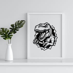 May include: Black and white illustration of a dinosaur head breaking through a wall. The dinosaur is roaring with its mouth open and its teeth showing. The dinosaur's eyes are wide open and its claws are extended.