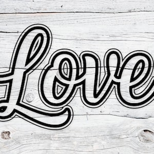 May include: Black and white script design of the word "Love" on a white wooden background. The word is in a bold, cursive font with a black outline, creating a 3D effect. The background has a rustic, weathered appearance.
