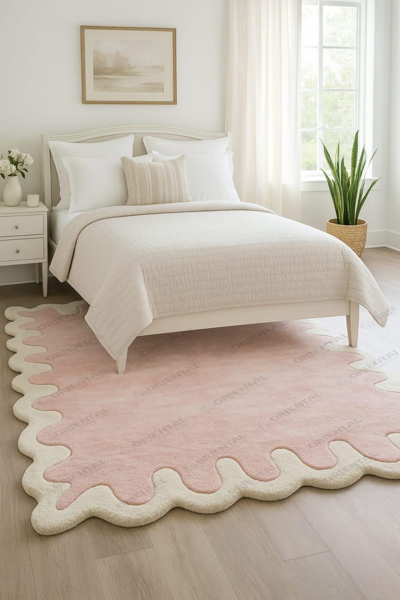 Hand tufted wool rug 5x7 ft soft pastel pink for cozy room Cute pastel pink rug 4x6 ft with scalloped cream border.