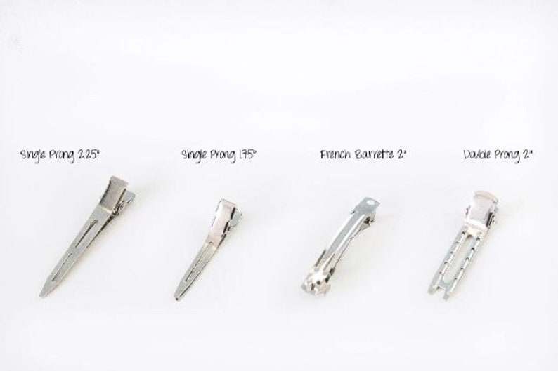 May include: Four silver hair clips on a white background. The clips include a Single Prong 2.25", a Single Prong 1.75", a French Barrette 2", and a Double Prong 2". The text above each clip indicates the style and size.