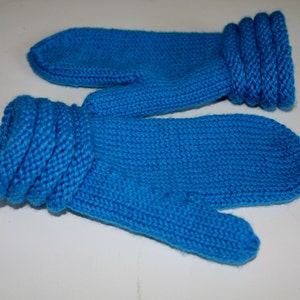 May include: A pair of blue knitted mittens with a folded cuff. The mittens are made of a soft, warm yarn and are perfect for keeping your hands warm in the winter.