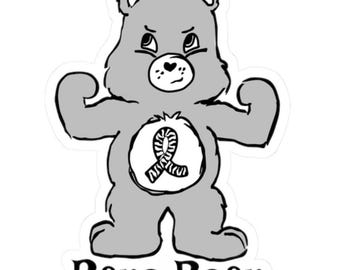 May include: A black and white illustration of a gray cartoon bear with a striped ribbon on its chest. The bear is flexing its biceps and has a serious expression on its face. The text "Rare Bear" is written below the bear.