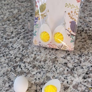 May include: A rustic wooden sign with the text "Welcome to our home" in white lettering. The sign features a distressed finish and a simple, inviting design, perfect for entryway decor.