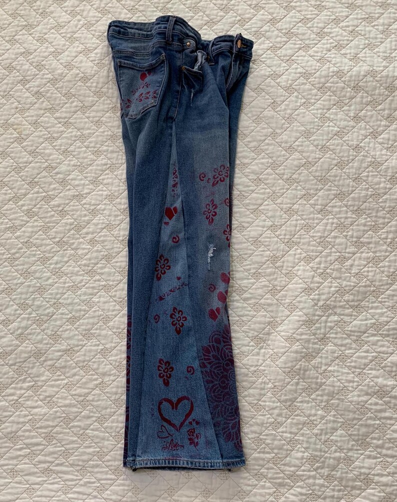 Side gusset added for comfort and a flare leg. Also stenciled with hearts, roses and the word "love"