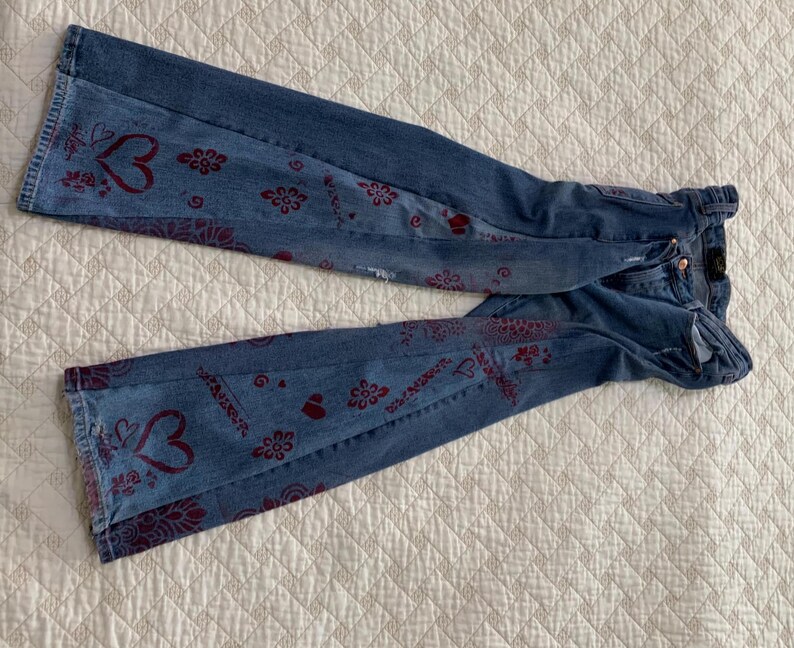 Denim gussets show hearts,roses, garlands and the word "love"