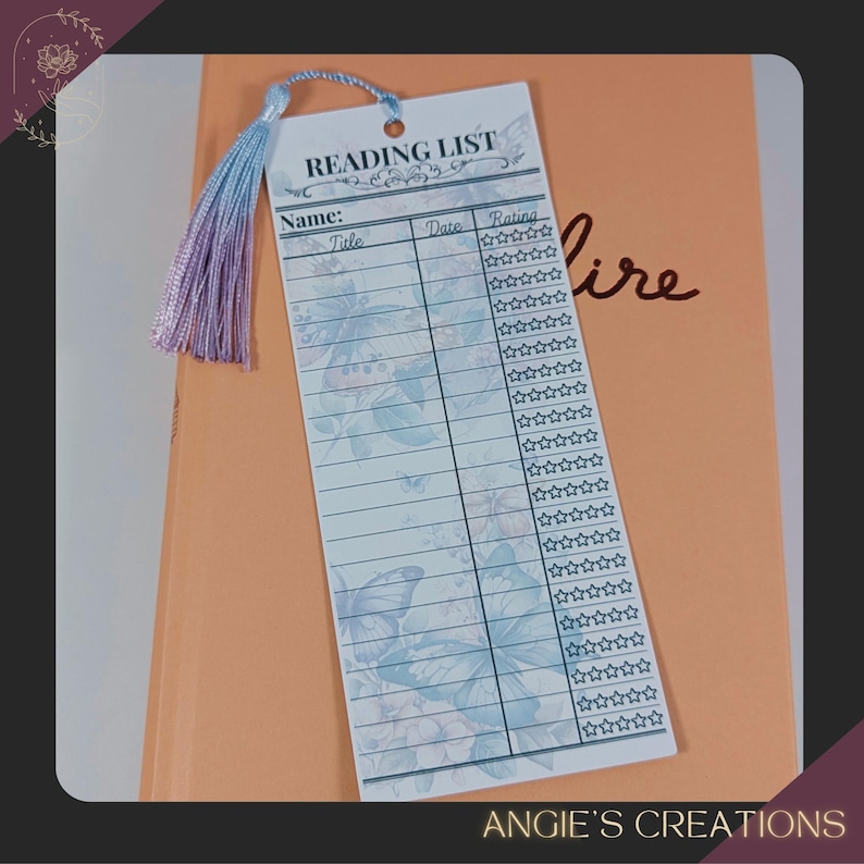 a reading list card with a tassel attached, placed on top of a folder or book.