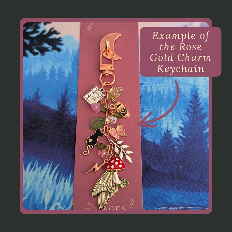 Stag Throne of Glass Inspired Charm Keychain. A rose gold charm keychain featuring a crescent moon clasp and multiple dangling charms including a book with the text Once Upon A Time, a coffee cup, a black cat, a pink butterfly.