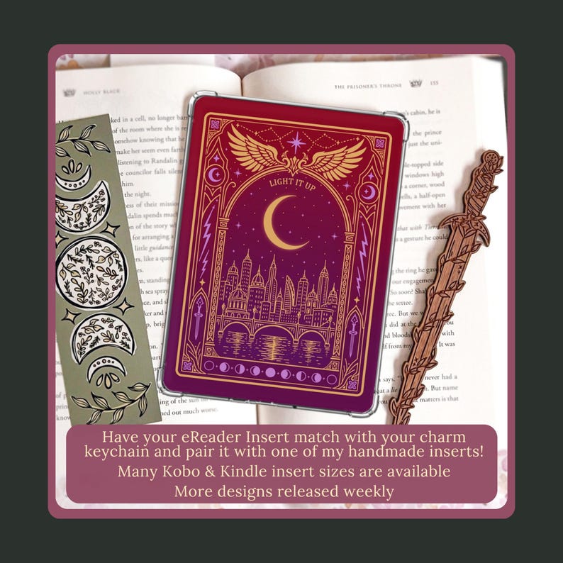Stag Throne of Glass Inspired Charm Keychain. A rectangular e-reader insert featuring a deep red background with a gold-coloured illustration of a city skyline, a bridge, a crescent moon, and wings.
