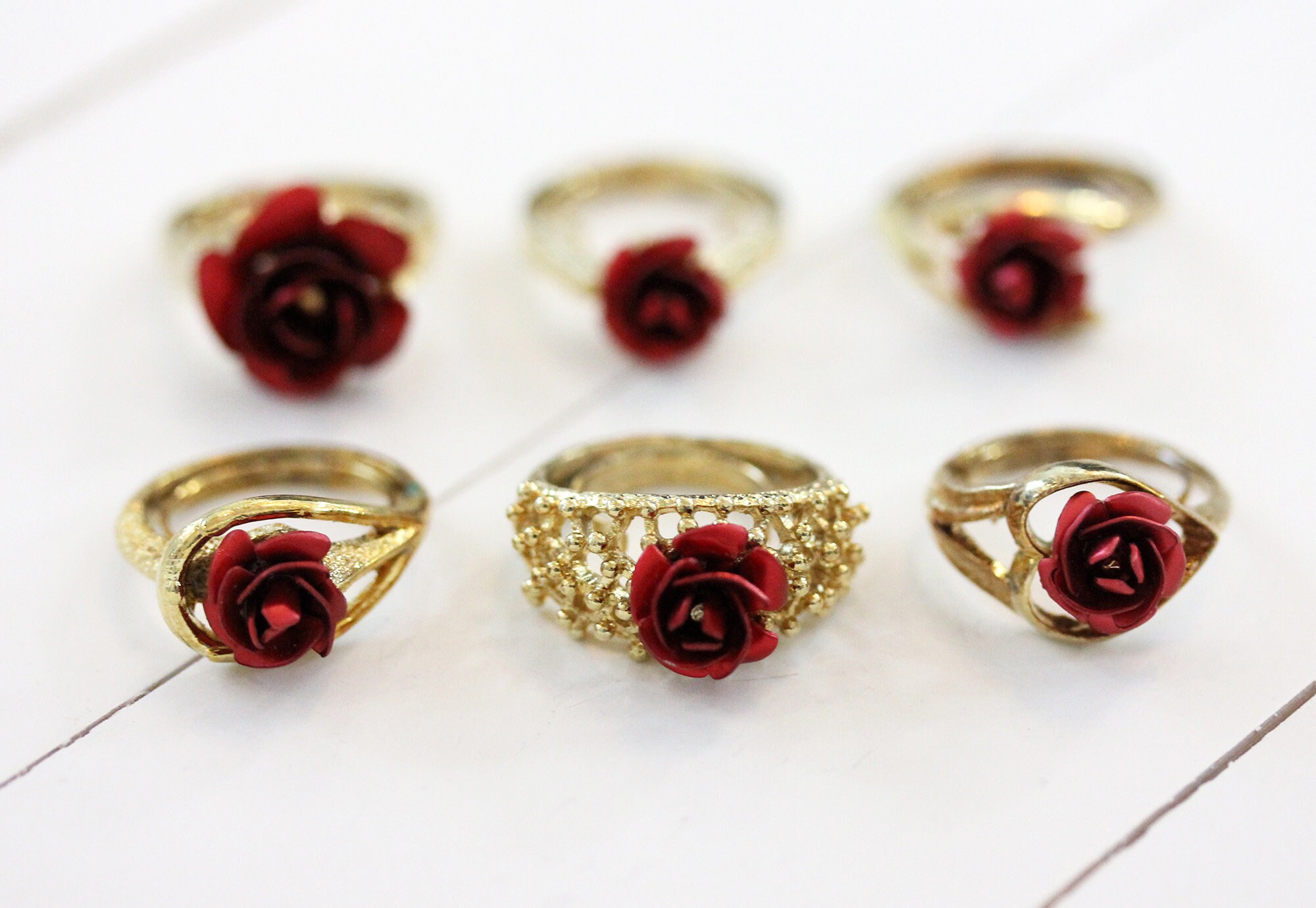 Gold ring with red best sale rose