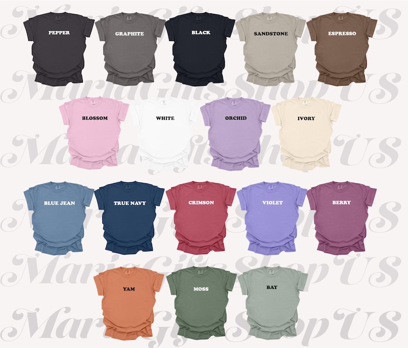 May include: A collection of short-sleeved t-shirts in various colors, including black, white, and blue. Each shirt has a different color name printed on the front. The shirts are neatly arranged, showcasing a range of hues.