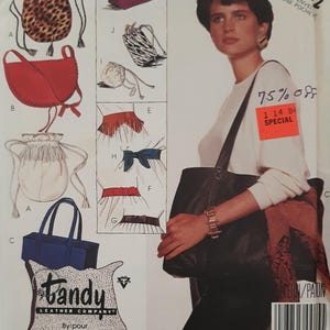 May include: A sewing pattern for a variety of bags, including a tote bag, a drawstring bag, and a hobo bag. The pattern is from McCall's and is for the Tandy Leather Company. The pattern is for size 332 and is on sale for 75% off.