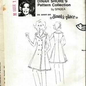 May include: Vintage sewing pattern featuring a double-breasted apron dress design. The pattern is from Dinah Shore's Pattern Collection by Spadea, as seen on "dinah's place". The image includes a portrait of Dinah Shore.